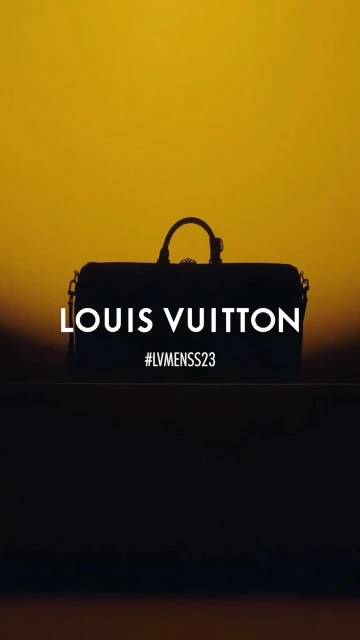 Silhouette of a Louis Vuitton duffel bag against a golden sky, featuring the brand name and #LVMENSS23 in a minimalist composition.
