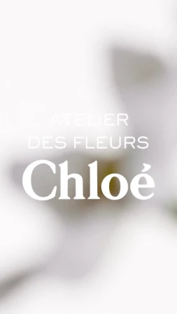 Abstract floral display for Chloé's Atelier des Fleurs, featuring blurred white flowers and minimalist text overlay.