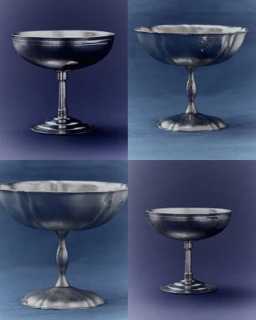 Silver-colored metal goblets are displayed in a grid pattern against a blue background, exhibiting a simple yet elegant design.