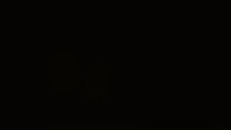 Extremely dark and underexposed image showing almost solid black composition with minimal lighting.