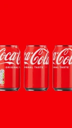 Three Coca-Cola beverage cans in a row against a solid bright red background