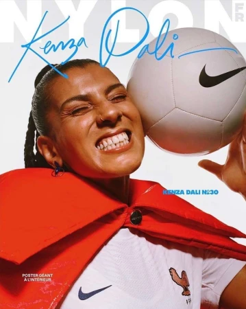 A vibrant magazine cover featuring an adult female athlete with a soccer ball, set against a bright background and bold magazine typography.