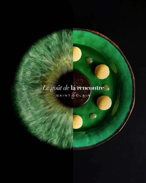 Artful food presentation on a green plate next to a digitally created green eye, all against a black background.