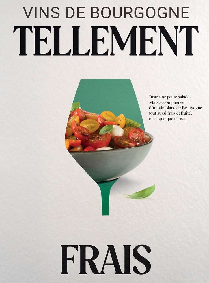 Wine advertisement featuring a salad bowl within a green wine-glass-shaped cutout on a white background, with the words Vins de Bourgogne.