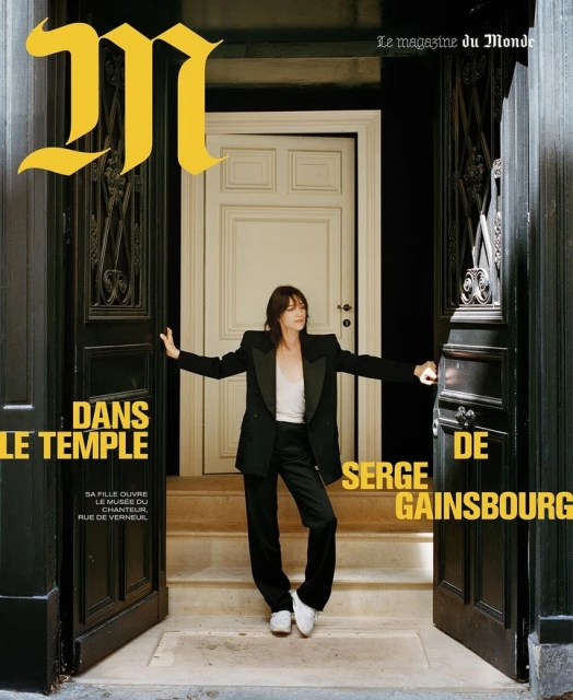 Magazine cover featuring an adult woman in a black suit standing in a doorway with the magazine logo and other text overlayed.