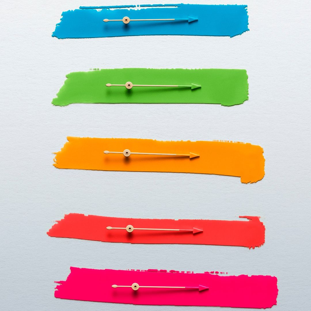 Abstract artwork with blue, green, orange, red, and pink paint strokes, each featuring a golden arrow, against a white background.