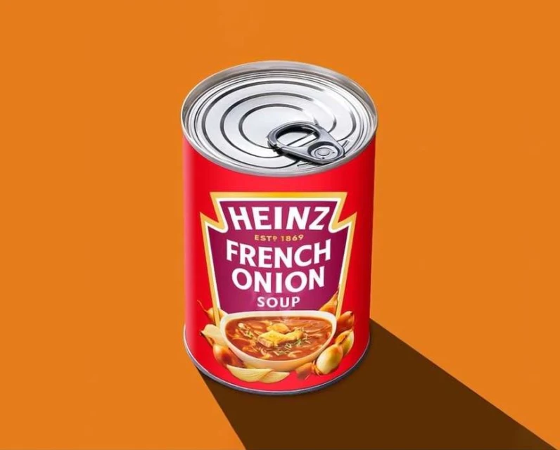 Heinz French Onion soup can on an orange backdrop. A shadow from the can falls to the bottom right corner of the frame.