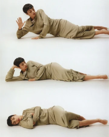 Person in olive green dress poses in three different positions, laying on their side against a white background in a photo studio.
