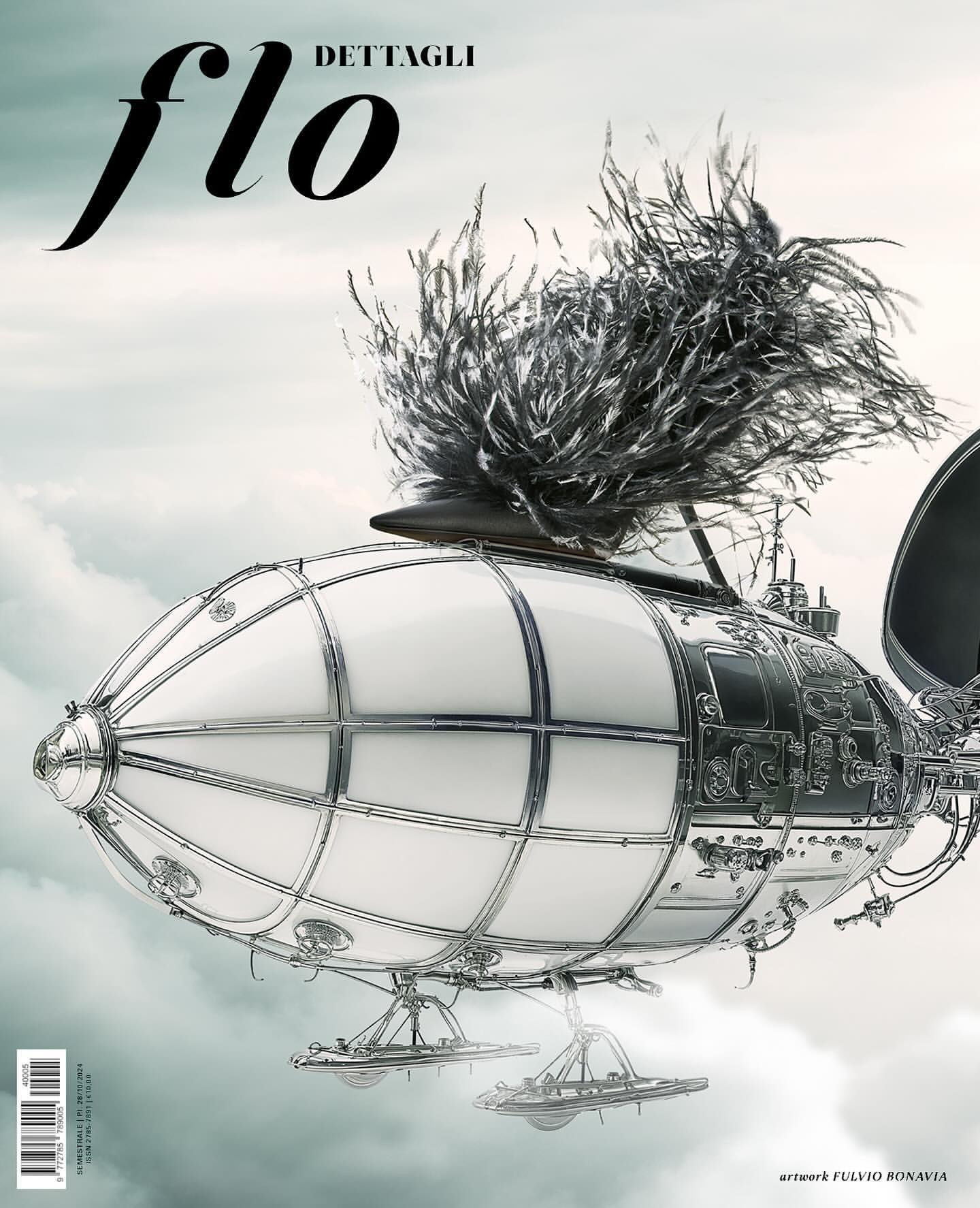 Artistic rendering of an airship with decorative feathers against a cloudy sky, featured on the cover of 'Flo Dettagli' magazine.