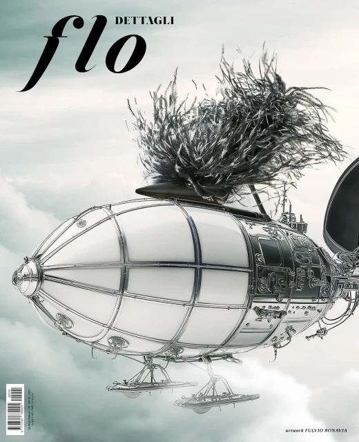 Artistic rendering of an airship with decorative feathers against a cloudy sky, featured on the cover of 'Flo Dettagli' magazine.