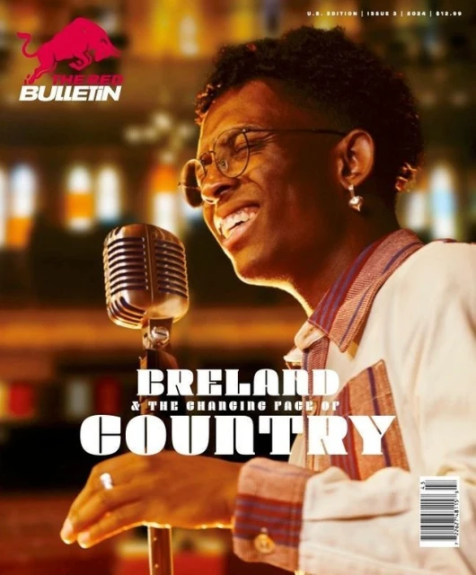 Magazine cover featuring Breland, a Black male singer with glasses, singing into a vintage microphone. Red Bull logo visible.