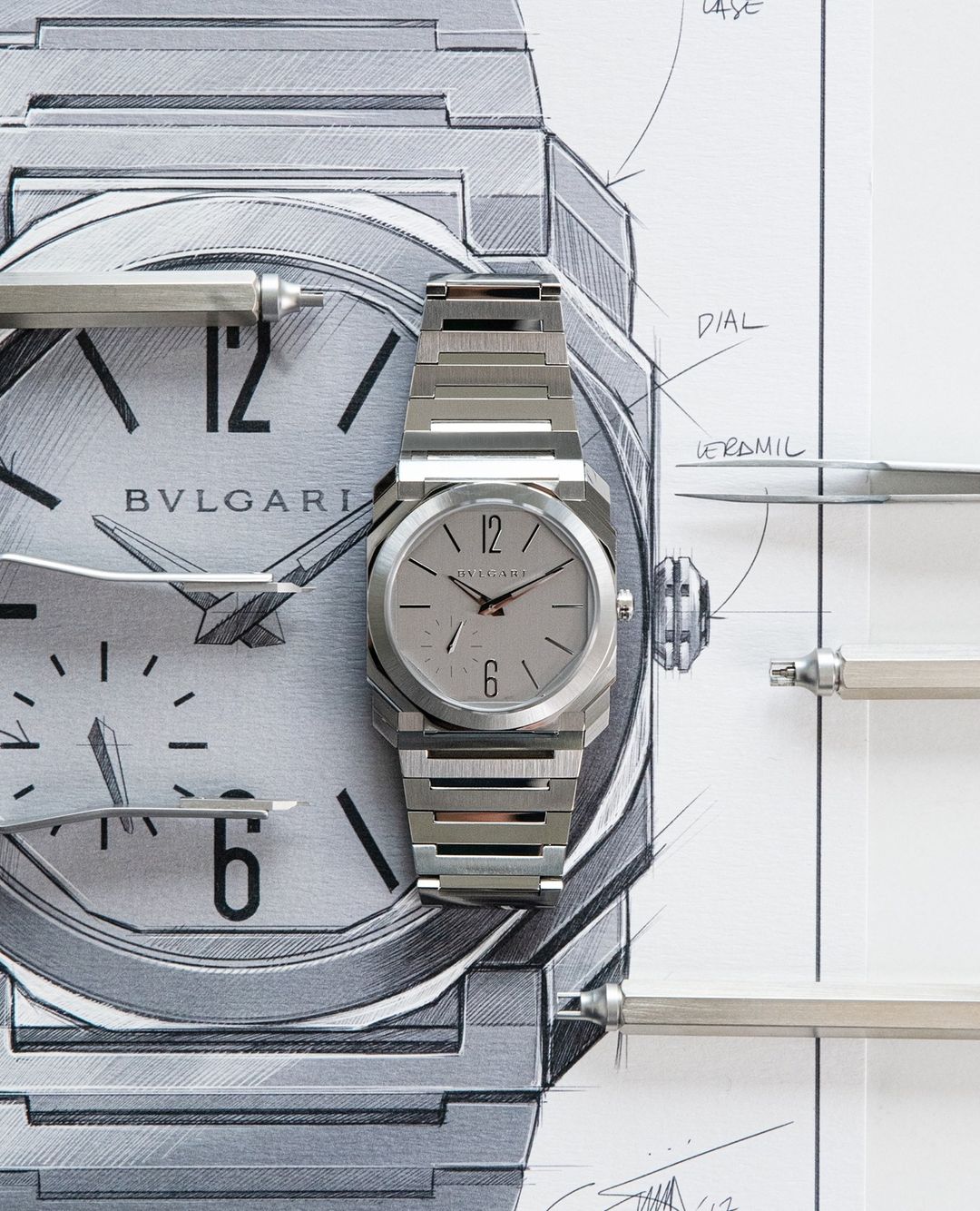 Silver Bulgari Octo Finissimo watch displayed over a sketch of the watch, showcasing a blend of horology and artistic design.