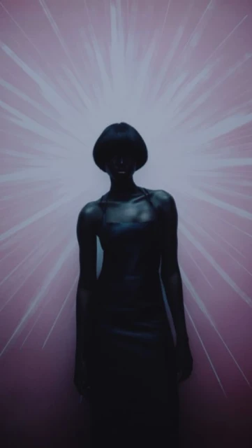 Dark-skinned woman in a black dress stands in front of a pink background with white starbursts, creating a stark and dramatic portrait.