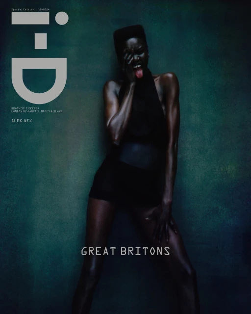 Magazine cover featuring a Black female model in black attire posing with her tongue out against a textured teal background.