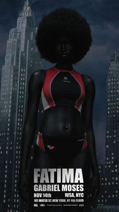 Full body portrait of an adult female fashion model in red and black swimwear, standing against an urban background with tall buildings.