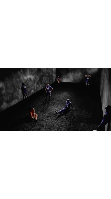 Multiple athletes in sports uniforms scattered in a dimly lit, minimalist indoor space with dark, cloudy background, creating a dramatic scene.