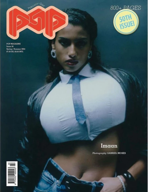 Magazine cover featuring a stylish woman with a blue tie and jeans, with the magazine's logo and issue details prominently displayed.