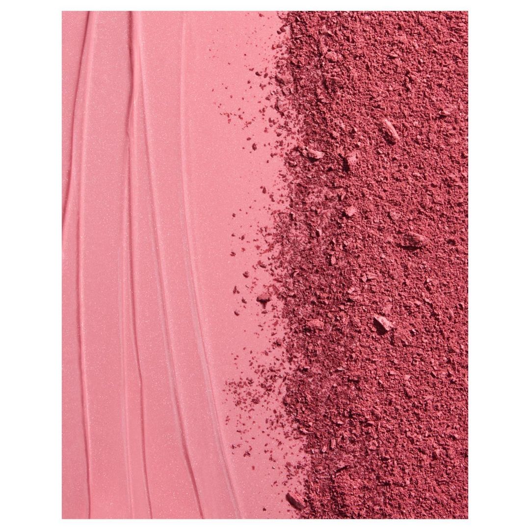 Macro studio shot of pink blush powder with textured and smooth segments. Beauty product photography for makeup or cosmetics content.