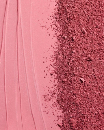 Macro shot of cosmetic blush product featuring a smooth cream texture alongside a section of crushed powder blush makeup.