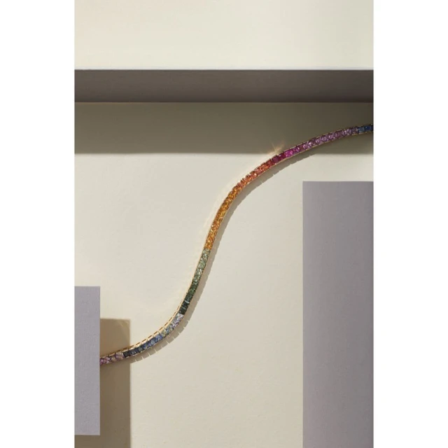 Rainbow sapphire bracelet on a beige geometric background, studio lighting, high angle view, Jewelry and Fashion photography.