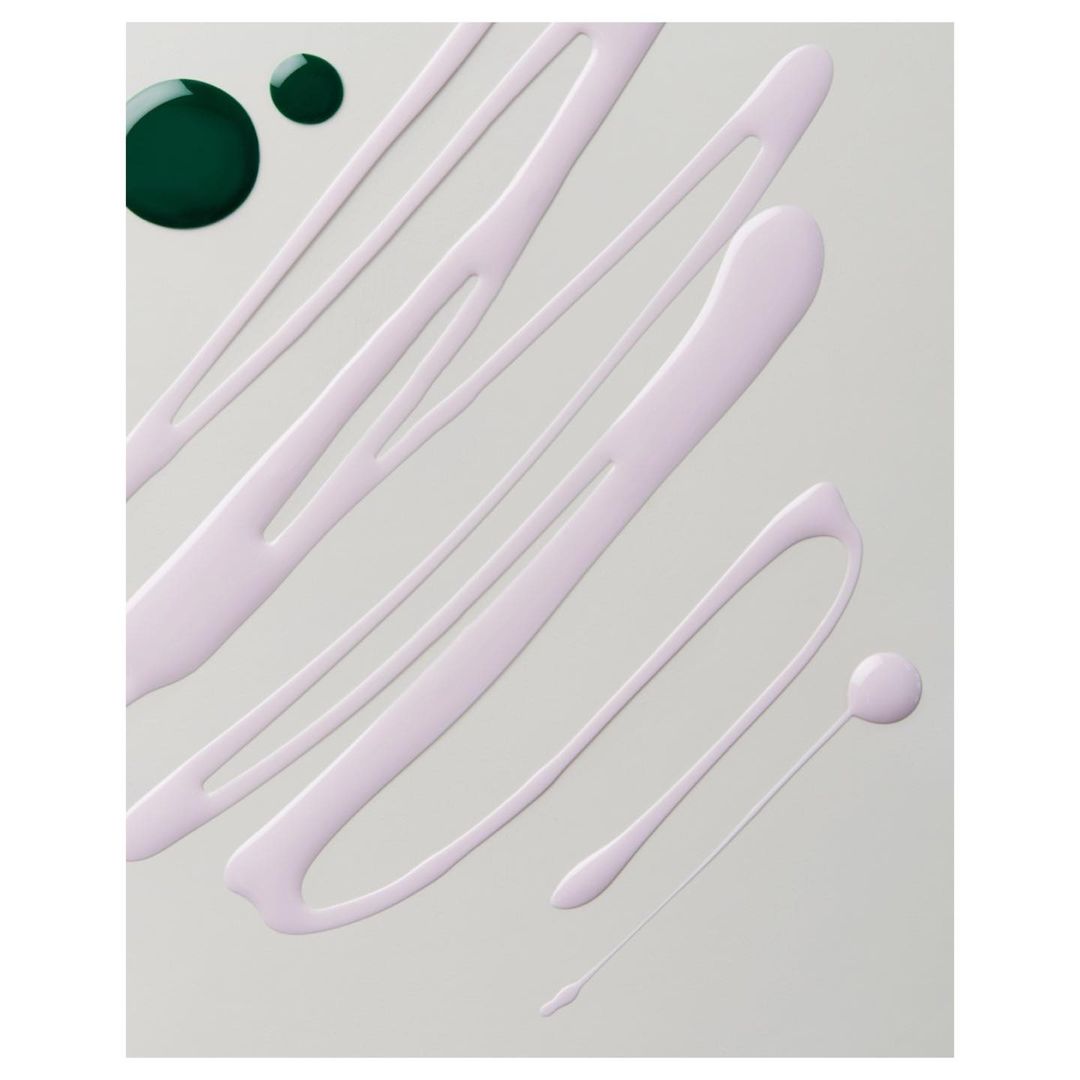 Abstract background features pale purple paint strokes and dark green paint dots on a smooth, light gray surface, creating a minimalistic design.