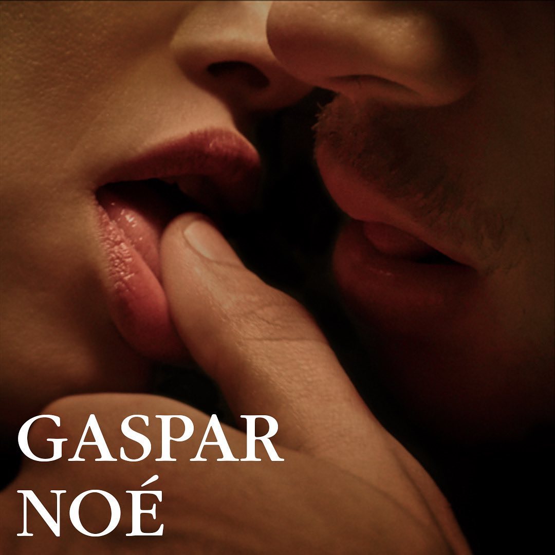 Close-up shot of a person placing their finger in another person's mouth, intimate and sensual interaction, Gaspar Noé text overlay.