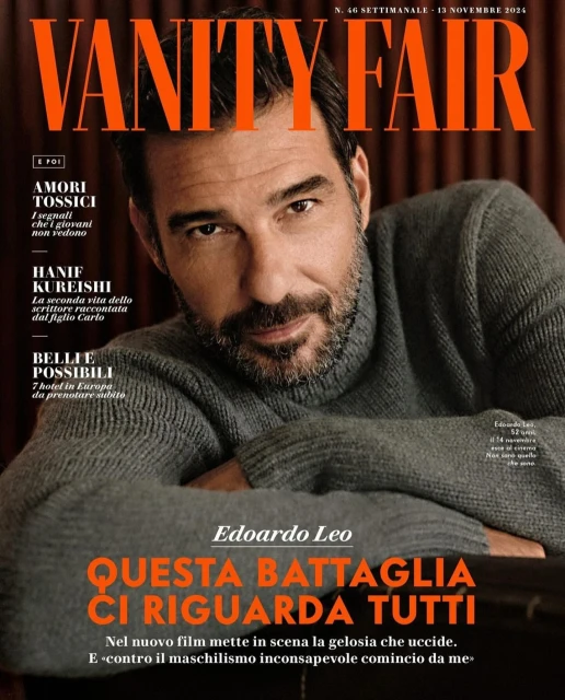 Magazine cover featuring Edoardo Leo in a grey sweater, with the Vanity Fair masthead and various article titles in orange text.