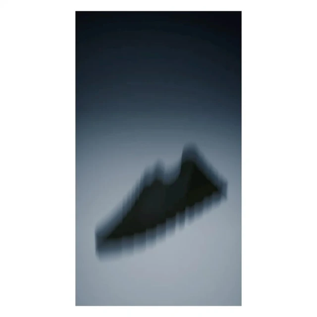 Abstract studio shot of athletic footwear with dynamic blur, blue color grading and atmospheric lighting.