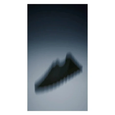 Abstract studio shot of athletic footwear with dynamic blur, blue color grading and atmospheric lighting.