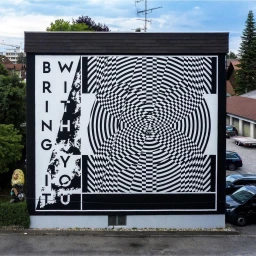 Large black and white optical art mural on a building exterior featuring bold typography reading BRING IT WITH YOU.