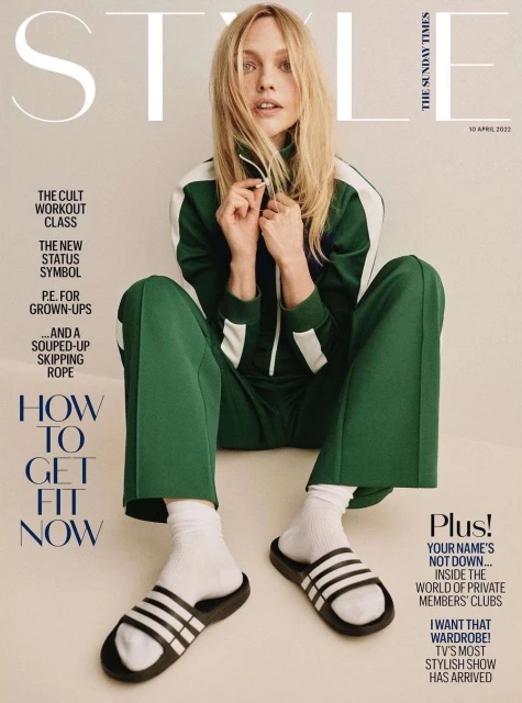 Magazine cover featuring a blonde model in a green tracksuit and socks with sandals, with "STYLE" and other text visible.