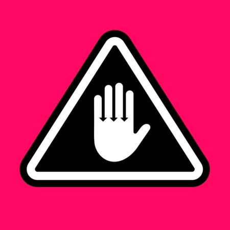 Warning sign with white hand graphic pointing downwards inside a black triangle on a hot pink background. Safety sign.