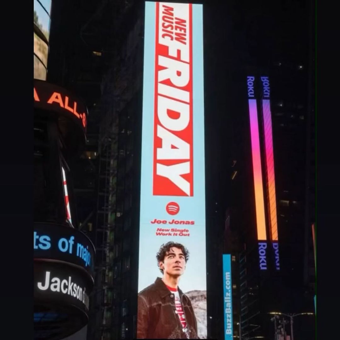 Joe Jonas billboard in Times Square at night advertises his new single 'Work It Out' on Spotify's New Music Friday campaign.