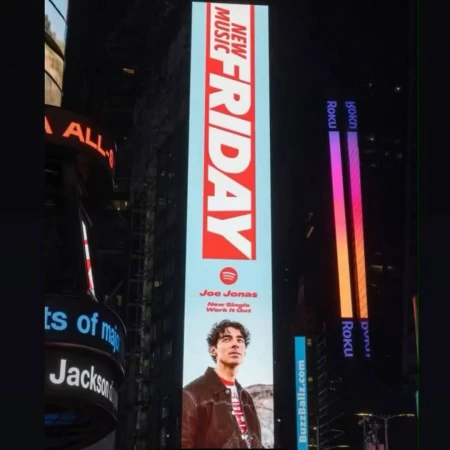 Joe Jonas billboard in Times Square at night advertises his new single 'Work It Out' on Spotify's New Music Friday campaign.