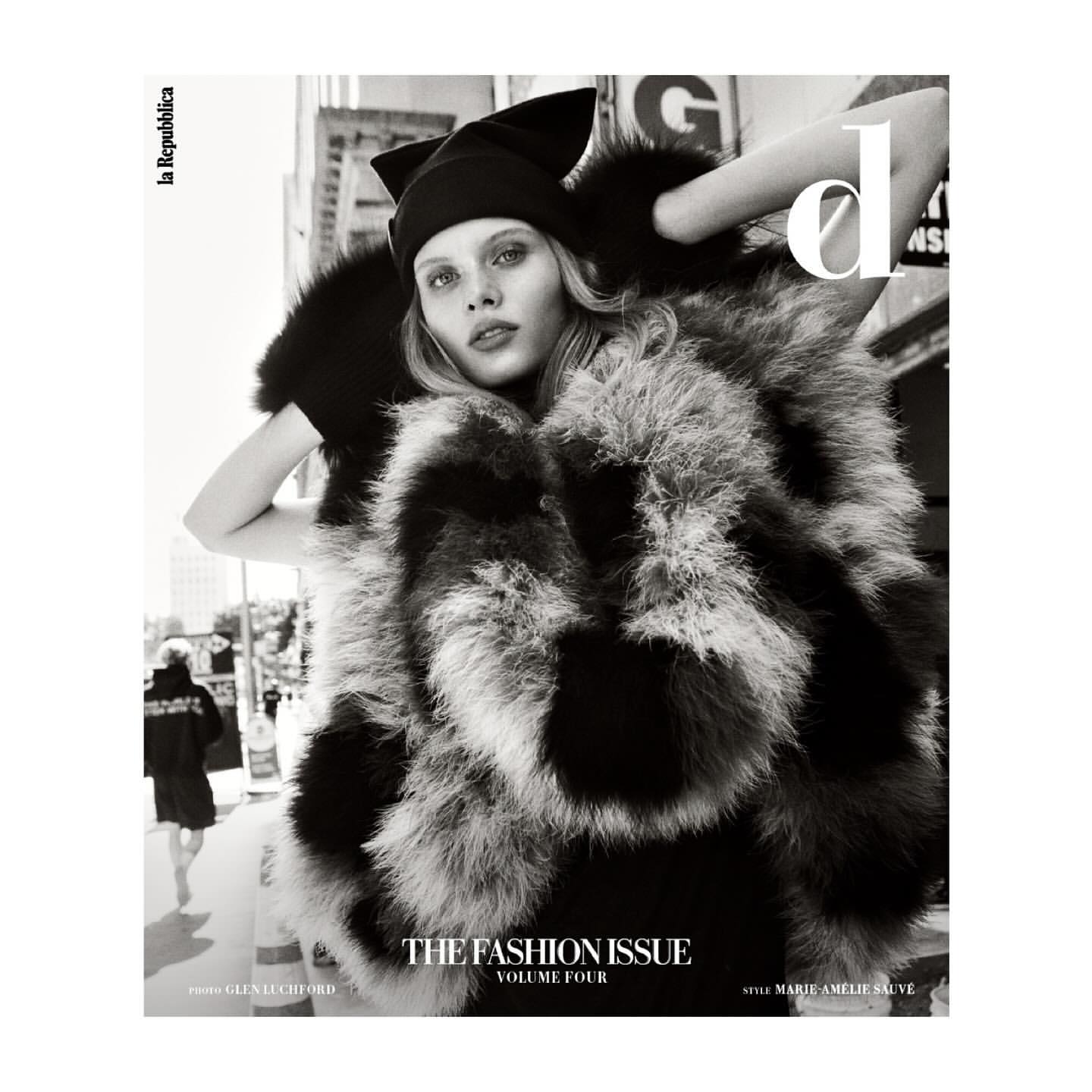 Monochrome fashion magazine cover featuring a model in a fur coat and hat against an urban backdrop, with the publication name visible.