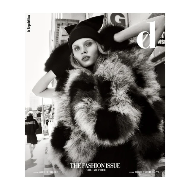 Monochrome fashion magazine cover featuring a model in a fur coat and hat against an urban backdrop, with the publication name visible.