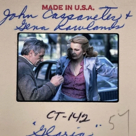 Vintage slide showing John Cassavetes and Gena Rowlands outdoors near a car by Glen Luchford