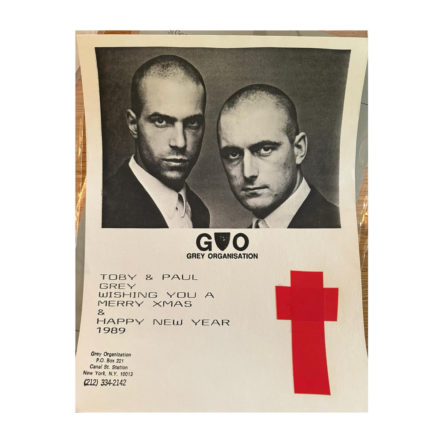 Black and white image of two adult males in suits, side-by-side, for Grey Organisation's 1989 Christmas and New Year greeting card.