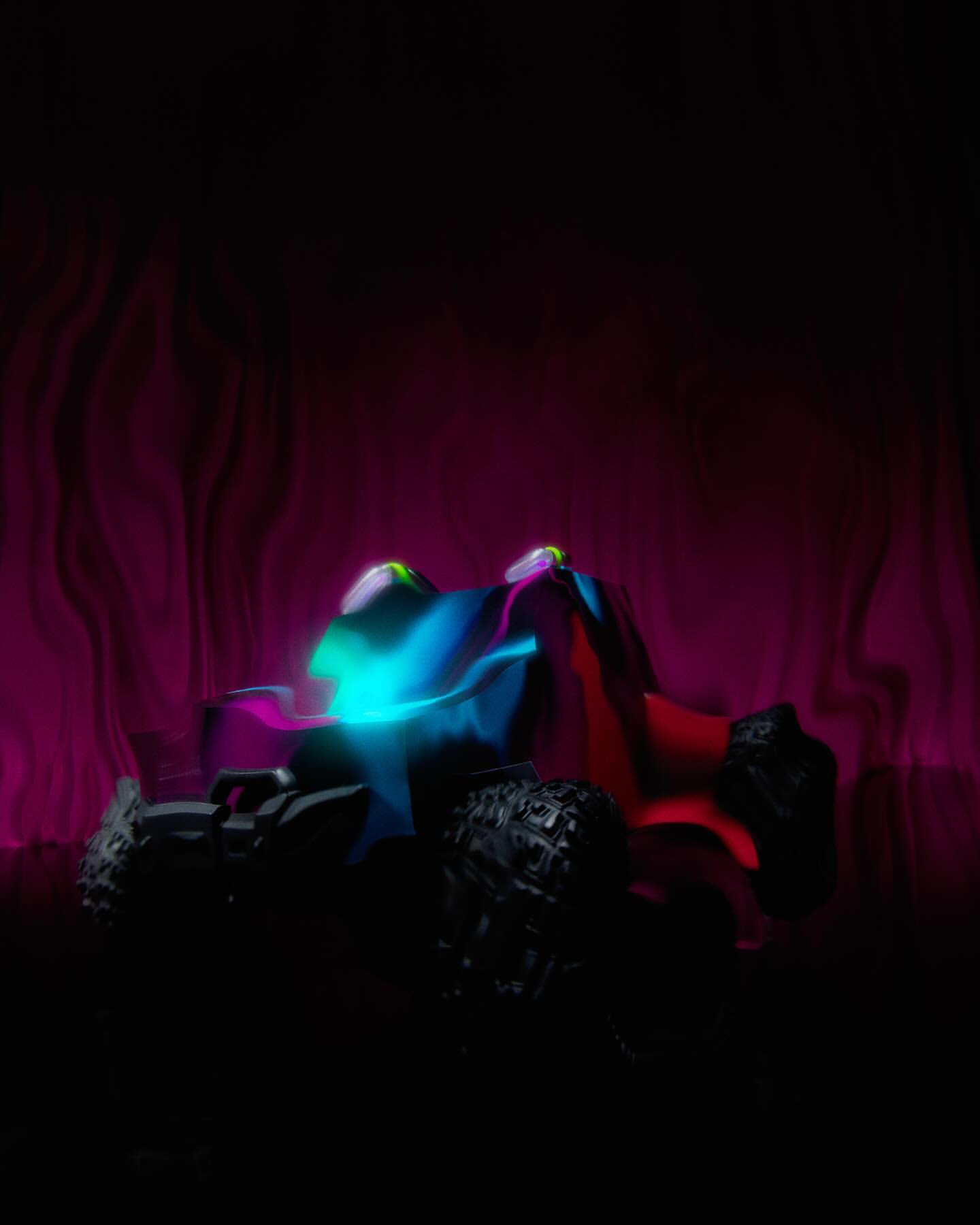 CGI image of a toy monster truck with black tires and illuminated with blue, red, and pink lighting against a dark background.