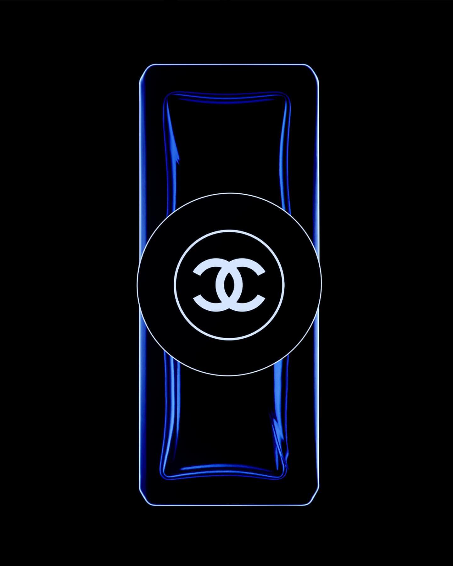 Chanel No. 5 perfume bottle with blue tint and a black background for high contrast and minimalist aesthetic.