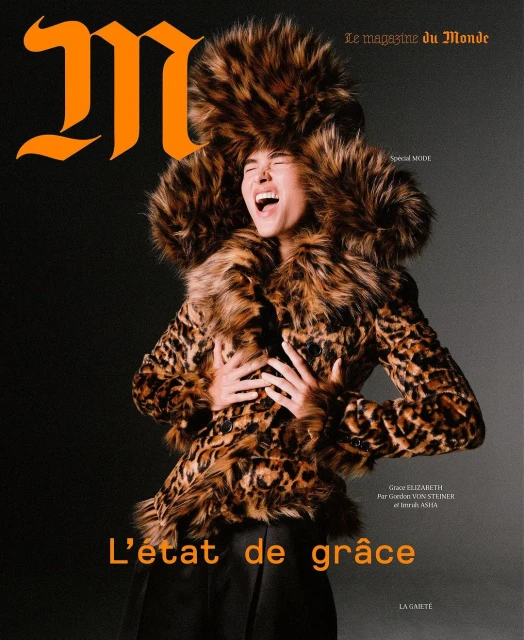 Magazine cover featuring a woman in a leopard print coat and matching fur hat, against a dark backdrop with the masthead 'M'.