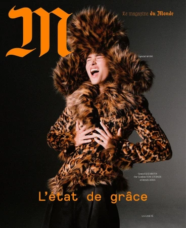 Magazine cover featuring a woman in a leopard print coat and matching fur hat, against a dark backdrop with the masthead 'M'.