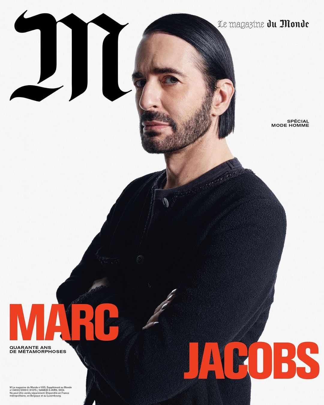 Magazine cover featuring Marc Jacobs in a black sweater with crossed arms against a white backdrop, showcasing a portrait orientation.