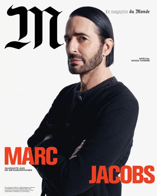 Magazine cover featuring Marc Jacobs in a black sweater with crossed arms against a white backdrop, showcasing a portrait orientation.