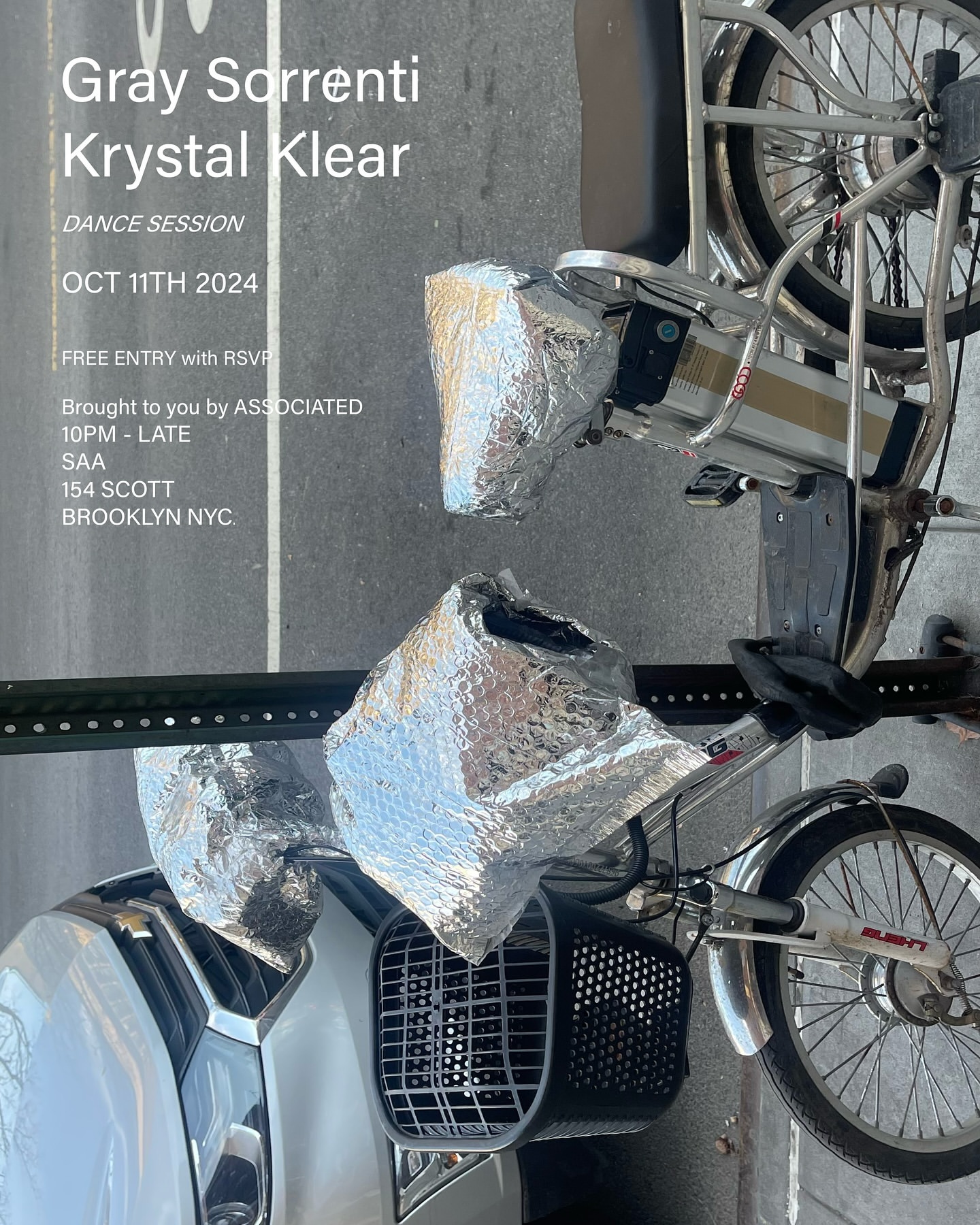 Silver Chevrolet next to silver-covered bicycle on city street, poster for Gray Sorrenti and Krystal Klear's dance session on October 11th, 2024.