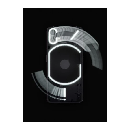 The back of a black smartphone is shown with illuminated glyphs. The phone is centered against a black background with motion blur effects.
