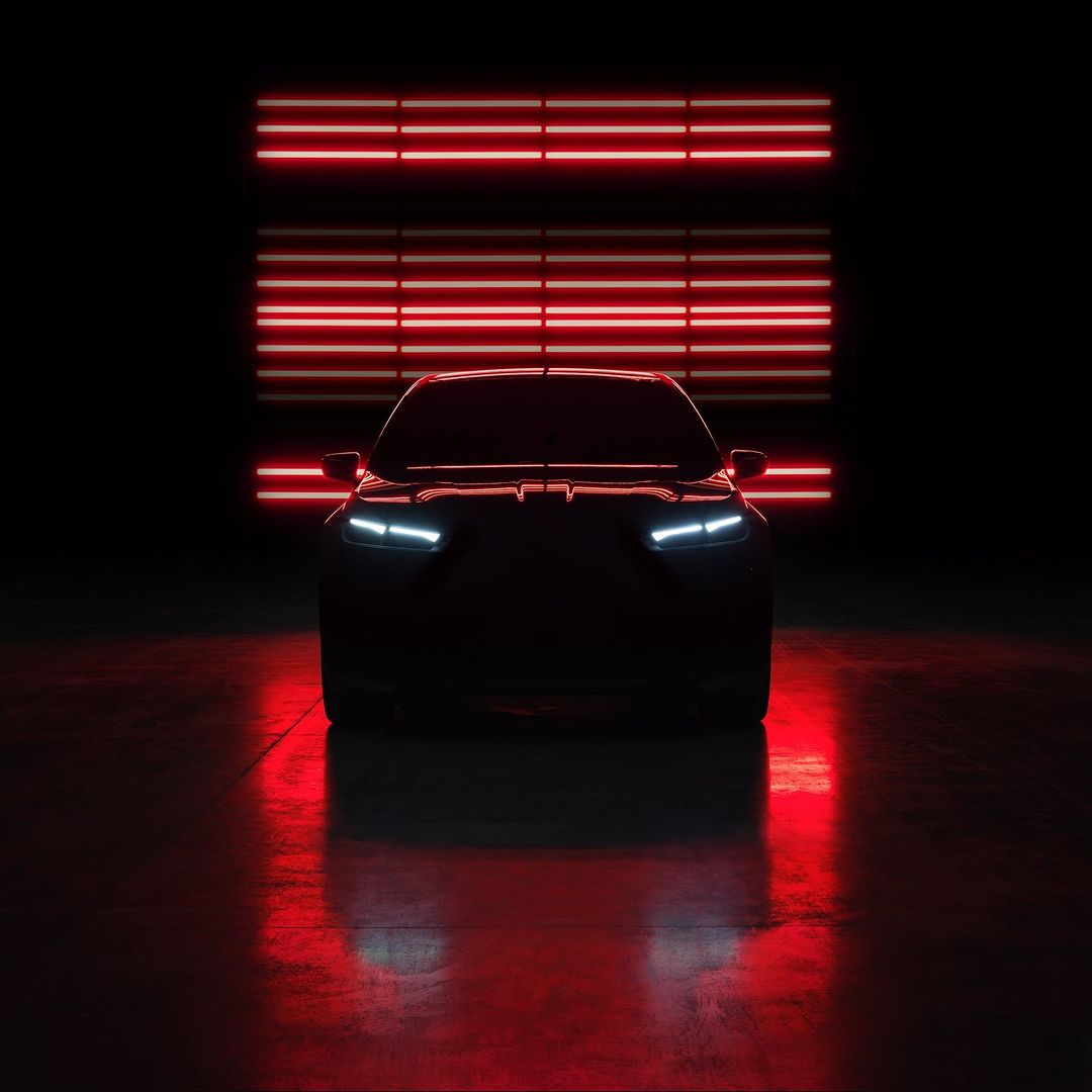 Sleek, shadowed car with glowing headlights, set against a dark backdrop with horizontal neon red lighting, evoking a modern, automotive feel.