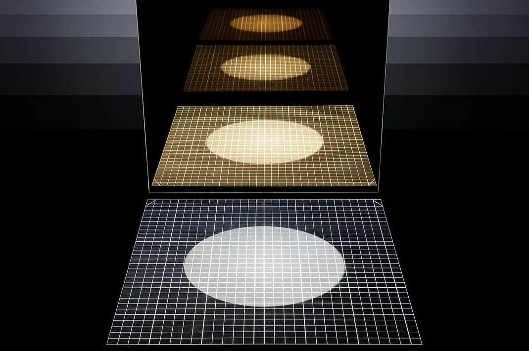 Abstract image with geometric shapes: a square grid with a circular light in a dark studio, with reflections and grayscale gradients.