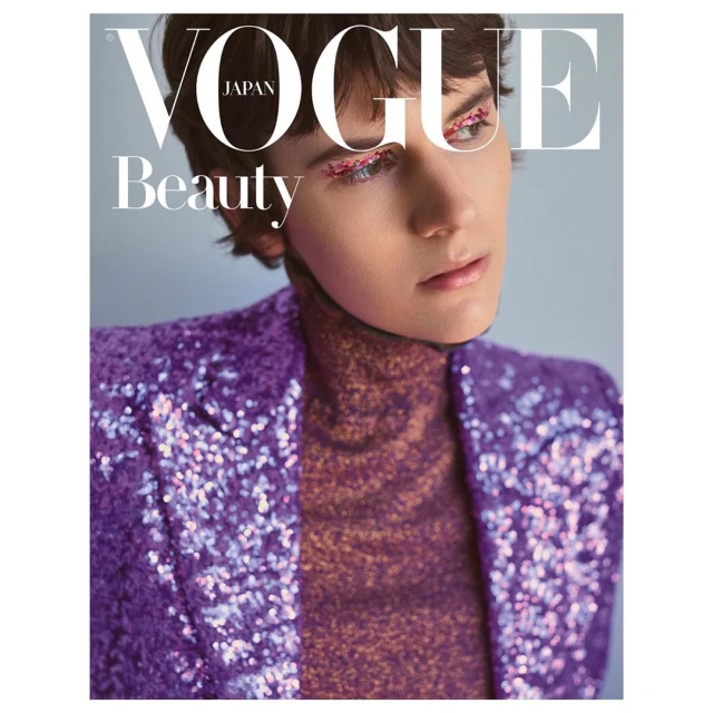 Vogue Japan beauty cover featuring a young woman with a purple sequin jacket, glittering eye makeup, and short brunette hair.