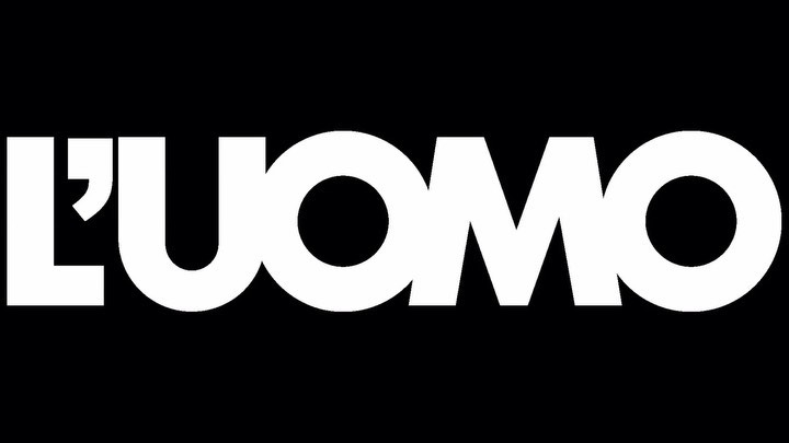 Bold typographic logo of L'UOMO magazine against a solid black background, featuring high contrast and modern sans-serif font.